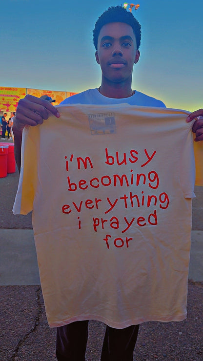 I'm busy becoming everything I prayed for Unisex Oversized Tee