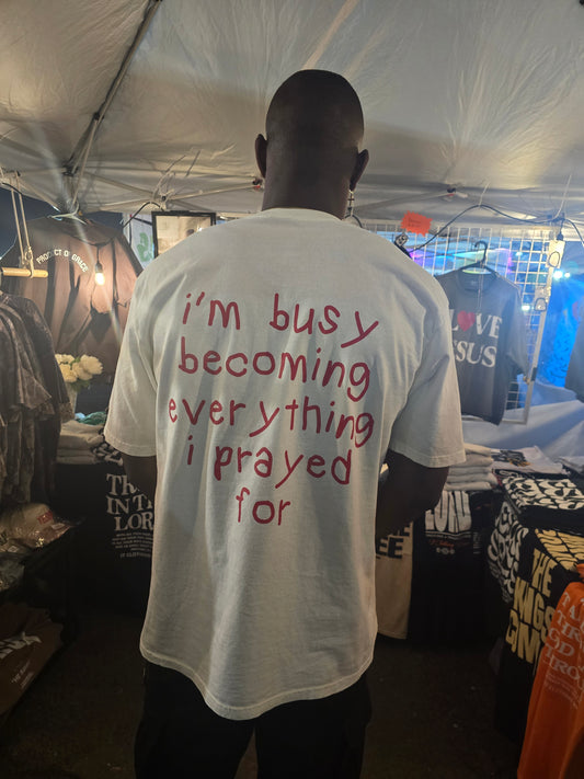 I'm busy becoming everything I prayed for Unisex Oversized Tee